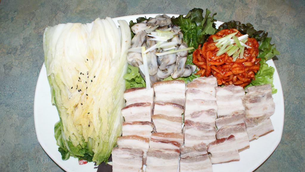 82. Gul Bo Ssam · Rice, fresh oyster and steamed pork rolled in Chinese cabbages.