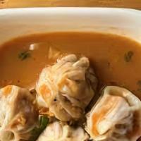 Chicken Momo Jhol · Chicken dumpling served with momo soup (sesame, soybean & tomatoes).
