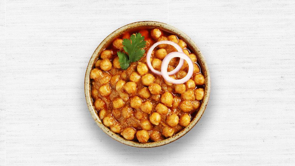 Chana Masala · Chickpeas cooked with onions, tomatoes, and spices. Served with basmati rice.