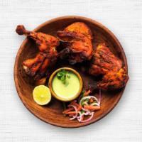 Tandoori Chicken · Chicken marinated in yogurt and spices and cooked in our tandoori oven.