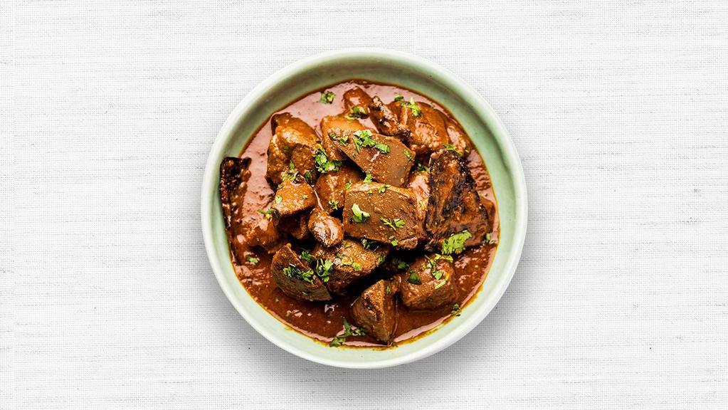 Lamb Curry · Lamb cooked in a spiced herb curry.