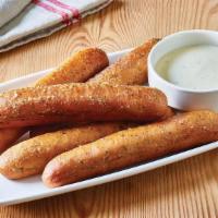 Breadsticks With Alfredo Sauce · Five golden brown signature breadsticks brushed with buttery garlic and parsley. Served with...