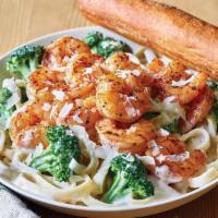 Classic Blackened Shrimp Alfredo · Blackened Shrimp is served warm on a bed of fettuccine pasta tossed with broccoli and rich A...