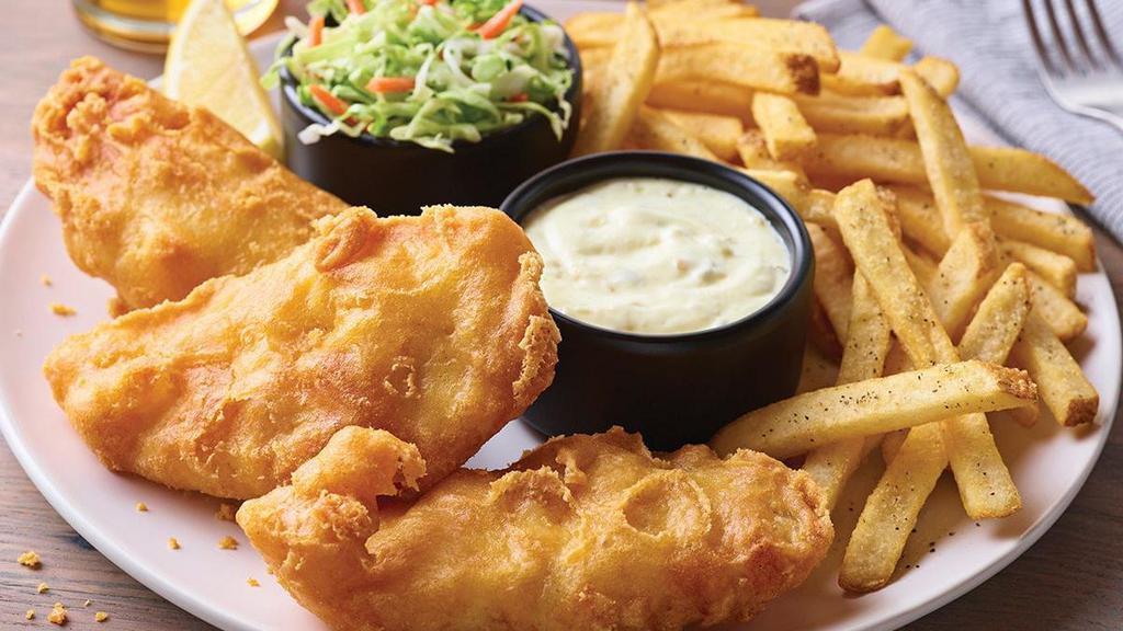 New England Fish + Chips · Golden, crispy-battered fish fillet with fries.  Comes with our signature coleslaw, tartar sauce and a lemon wedge.