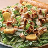 Grilled Chicken Caesar Salad · Crisp romaine tossed in garlic Caesar dressing topped with grilled chicken, croutons and sha...