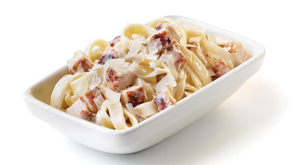 Kids Grilled Chicken Alfredo · Oodles of noodles covered with a creamy Alfredo sauce, then tossed with diced chicken and sprinkled with shredded Parmesan cheese.