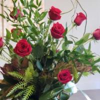 Classical Dozen Rose Design · A classic dozen rose design, with curly willow branches, cylinder vase, & foliage.