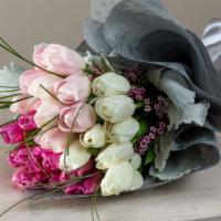 Tender Love · A mixed bouquet of flowers including roses.