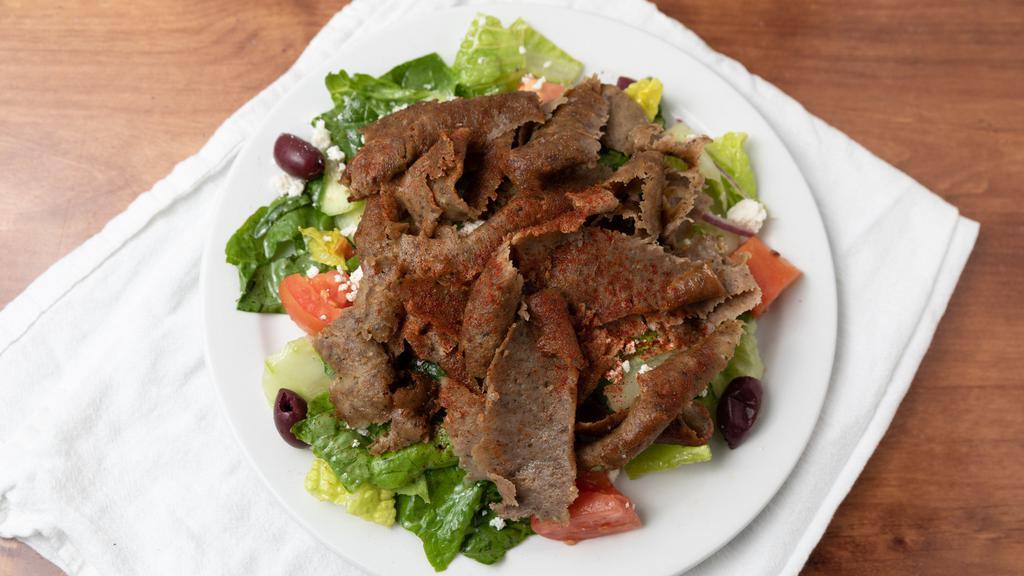 Gyro Salad · Hearts of Romaine lettuce, Roma tomatoes, cucumbers, red onions, kalamata olives, Feta tossed with our special dressing and gyro meat.