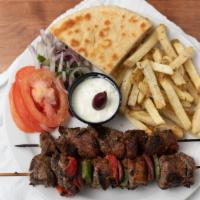 Lamb Plate · Two lamb skewers served with two pitas, tomatoes, red onions and tzatziki