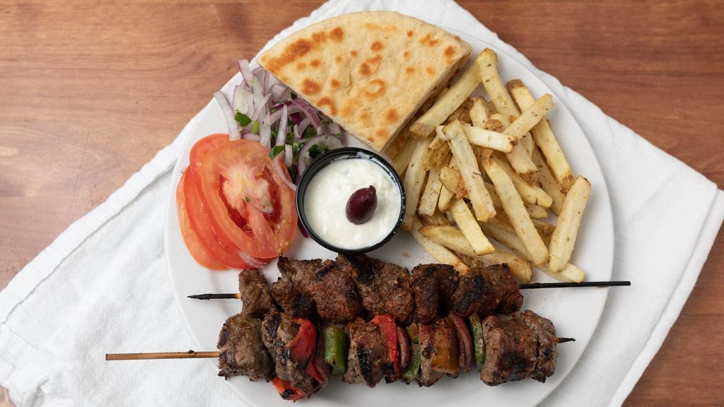 Lamb Plate · Two lamb skewers served with two pitas, tomatoes, red onions and tzatziki