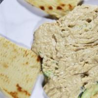 Hummus-5 oz. · Spread made of chickpeas and our home blend of spiced served with two pites.