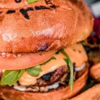 Story burger · Wagyu patty, fried onion, tomato, arugula, pickles, American