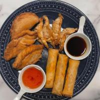 COMBINATION APPETIZER · VEGAN SPRING ROLLS, SAMOSAS AND CHICKEN POT STICKERS WITH SWEET SOUR, PONZU SAUCE.