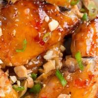CHICKEN WINGS · FRIED CHICKEN WINGS SAUTEED WITH SWEET CHILI SAUCE.