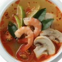 TOM YUM · HOT AND SOUR SOUP WITH CARROT, ONION, MUSHROOM.