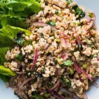 LARB CHICKEN · Minced chicken flavored with lime dressing, red onion, cucumber, cilantro and rice powder.