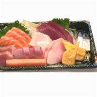 Chirashi · 18 assorted raw fish over seasoned rice. Served with miso soup.