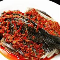 14. Steamed Whole Fish with Black Beans 湘味豆豉蒸活鱼 · Spicy.