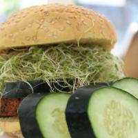 Eat Your Veggies · Cooked brown rice, black beans, alfalfa sprouts, cucumbers, hummus spread, and wheat bun.