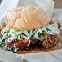 Fried Chicken Sandwich · Our signature Fried Chicken sandwich with mayo and a homemade charred chili jam. Cabbage sla...