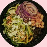 Greek Pesto Zoodle Bowl · Chilled Zoodles, Feta, Olives, Pickled Onions, Garbanzo beans, diced Tomatoes tossed in Pest...