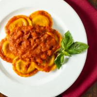 Ravioli di Carne al Pomodoro · Homemade veal ravioli in a tomato sauce.
