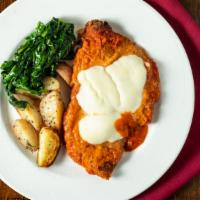 Chicken Parmigiana · Breaded and baked chicken in a tomato sauce with fresh mozzarella. Served with roasted potat...