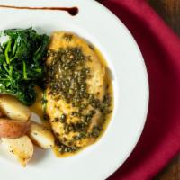Chicken Piccata · Chicken in a white wine-lemon sauce with capers. Served with roasted potatoes and sauteed sp...