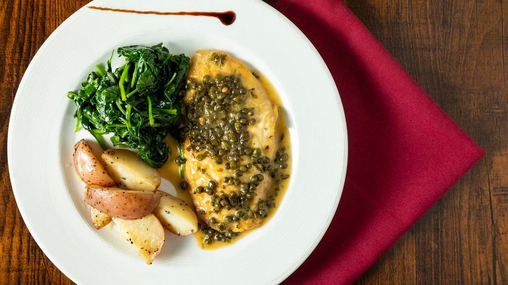 Chicken Piccata · Chicken in a white wine-lemon sauce with capers. Served with roasted potatoes and sauteed spinach.