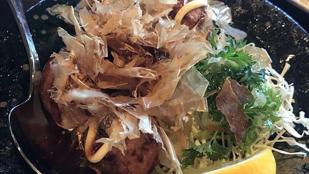114. Takoyaki · Deep fried Japanese octopus ball, top with fish flakes, mayo and tonkatsu sauce.