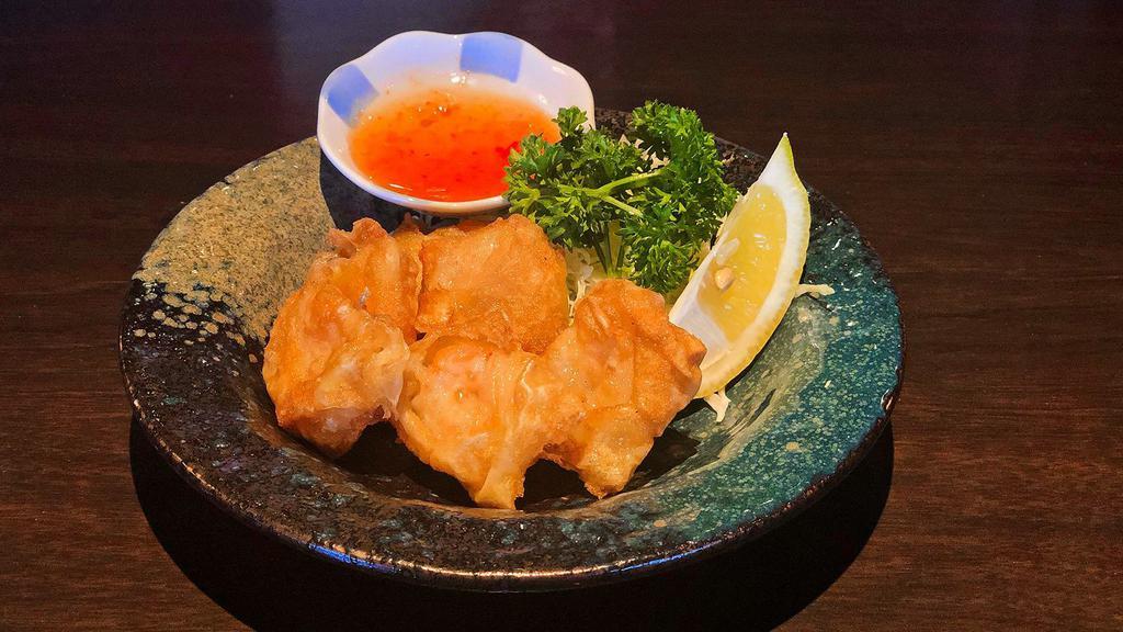 115. Fried Shrimp Wonton · Deep fried shrimp wonton with special sauce (6 pcs)