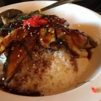 810. Unagi Rice · Barbeque eel over rice with unagi sauce, dried seaweed and sesame.