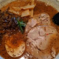 608. Black Garlic Ramen · Milky pork roasted black garlic flavor soup with sliced chashu, bamboo, fungus, egg, and gre...
