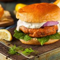 Salmon Burger · Mouthwatering Salmon Burger topped with lettuce, tomato, and tartar sauce.