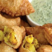 Vegetable Samosas (2) · Potatoes, carrots, peas in a creamy yellow curry. Dip in coconut coriander sauce.