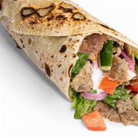 The Wrap · Comes with Garlic Yogurt, Greens, Tomato-Cucumber, and Pickled or Raw Onions.