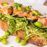 Toast-ess With The Mostest · Toast, Sesame Miso Spread, Hass Avocado, Baby Arugula, Salmon, Cucumber, Green Onions, White...