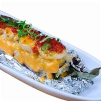 Volcano Roll · NO SUBSTITUTION, INGS: California roll topped w/Baked Scallop, Tobiko, Green Onion and Sauce