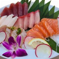 Sashimi Combination Deluxe · NO SUBSTITUTION (Chef's choice of 18 pcs of Sashimi Served with Salad and Rice)
