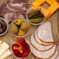 Charcuterie Board · Selection of California cheeses, and charcuterie served with cornichon, olives, fig jam, pic...