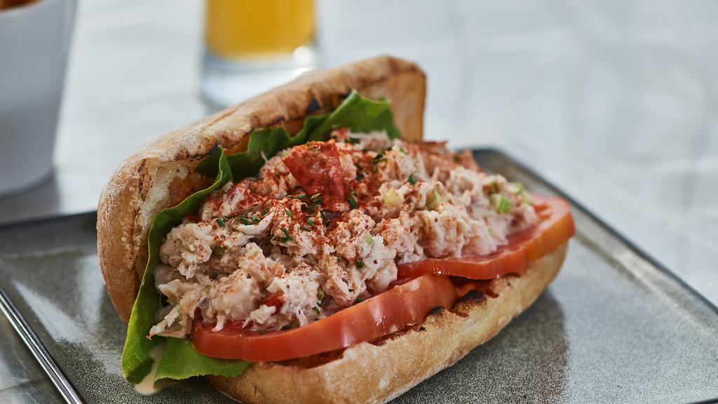 Crab And Shrimp Roll · Crab and shrimp on a grilled roll with leaf lettuce. Smoked paprika and old bay aloi served with french fries.