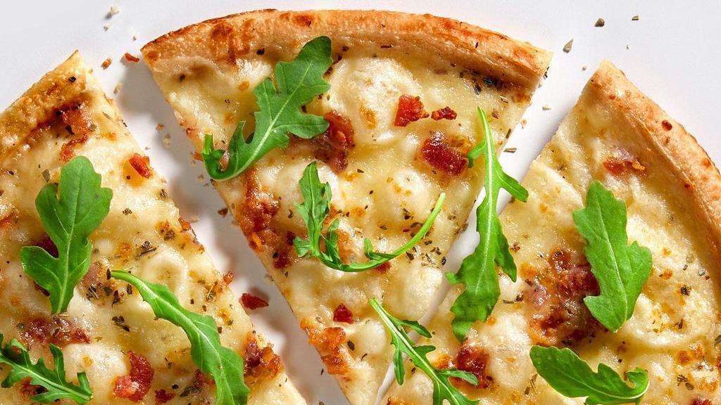 White Top Half 11-Inch Pizza + Choice Of Side · Our Chef’s signature recipe includes white cream sauce with mozzarella, applewood bacon, chopped garlic, oregano and arugula + choice of side. Limited substitutions. Want to customize with unlimited toppings? Try our Build Your Own Pizza instead!