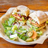 Milanesa Torta · Thin Fried Chicken, Avocado, Olive Oil, Lettuce, Tomato and Pickled Onion.