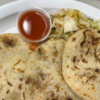 Pupusa Chicharrón Con Queso/ Pork Rid With Cheese · Thick griddle cake or flatbread from El Salvador and Honduras, made with cornmeal, cheese an...
