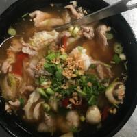 #26. Tom Yum Noodle Soup · Shrimps, ground pork, calamari, fish balls and bean sprouts in hot and sour soup.