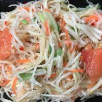 #15. Papaya Salad (Lao/Thai Style) · Spicy. Shredded green papaya mixed with tomatoes, green beans, toasted peanuts, fresh lime j...