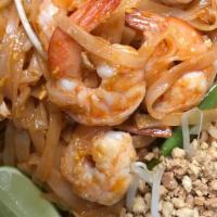 #60. Pad Thai · Rice stick noodles with your choice of meat, egg, tofu, green onion & bean sprouts, served w...