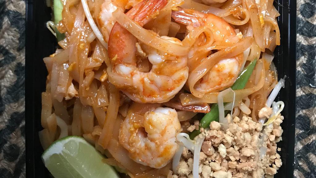 #60. Pad Thai · Rice stick noodles with your choice of meat, egg, tofu, green onion & bean sprouts, served with ground peanut & fresh lime, bean sprouts.