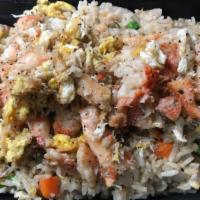 #67. Crab Meat Fried Rice · Fried rice with crab meat, egg and onions, peas and carrots.
